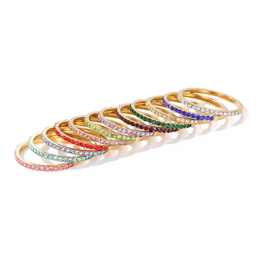 High polish 14K gold plated stainless steel birthstone circle ring on a clean background